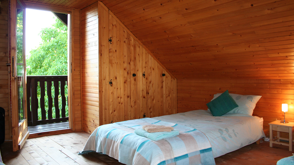 Family bedroom, with 4 single beds and balcony.